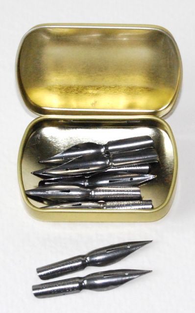 open leonardt storage tin showing nibs inside
