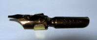 Dip pen nib with reservoir fitted