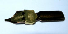 Underside of Dip pen nib with reservoir fitted